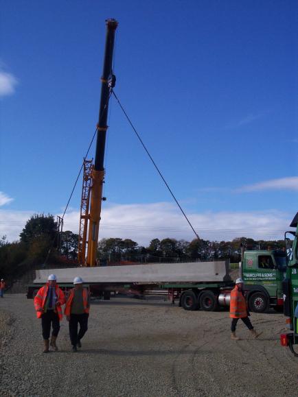 Crane offloading beams - In the photograph Roy Ashforth, Gary Liddell, Tim Lester.