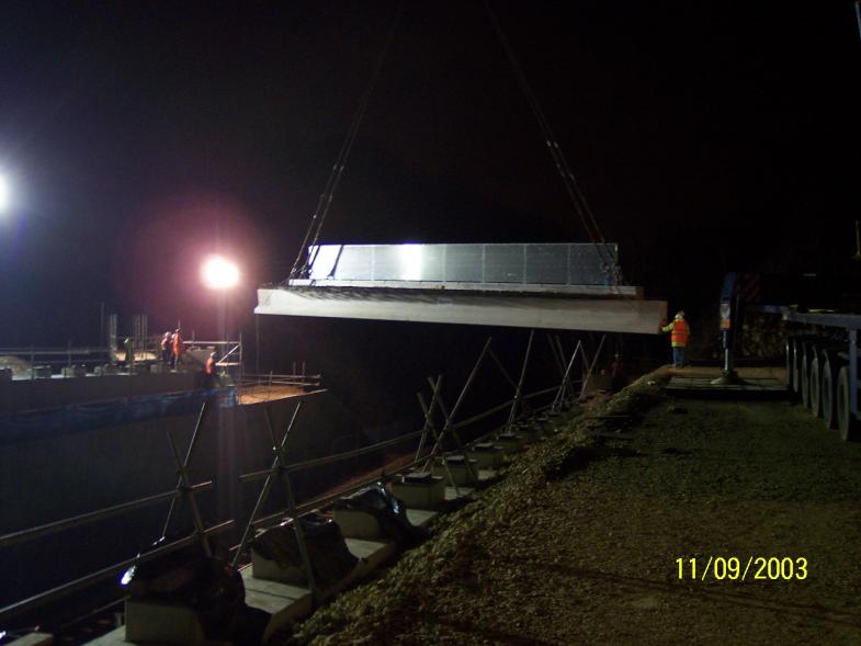 West edge beam being lifted into position in the Possession.