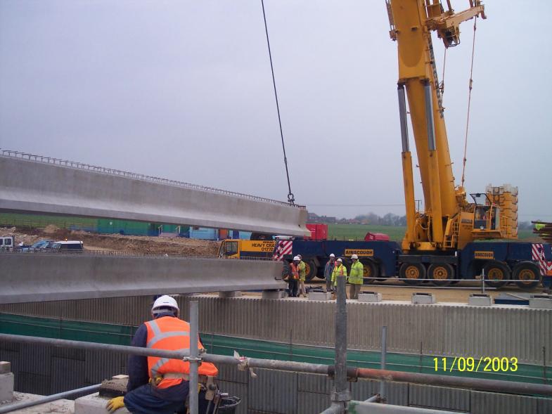 Internal beams being installed during the day with the crane moved down.