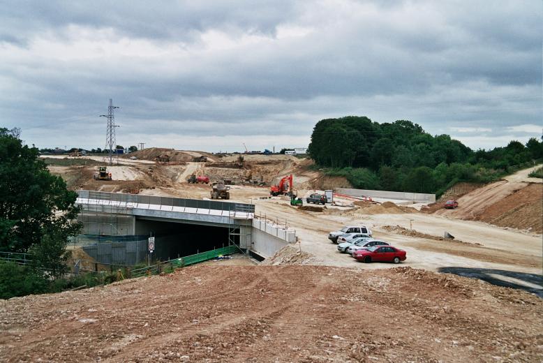 Works progressing on the divesion works beyond the bridge.