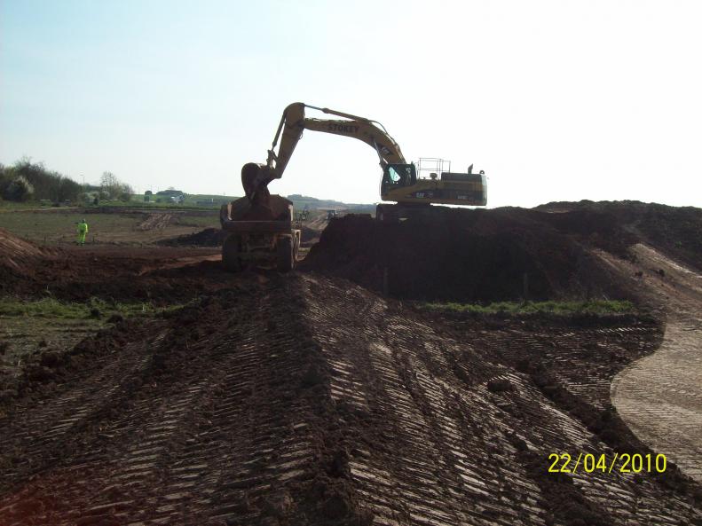 Old embankment being removed - trial.