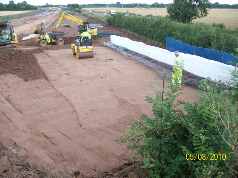 North corner reinforced earth under construction.