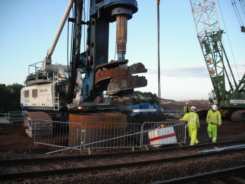 Drill rig drilling down inside the casing.