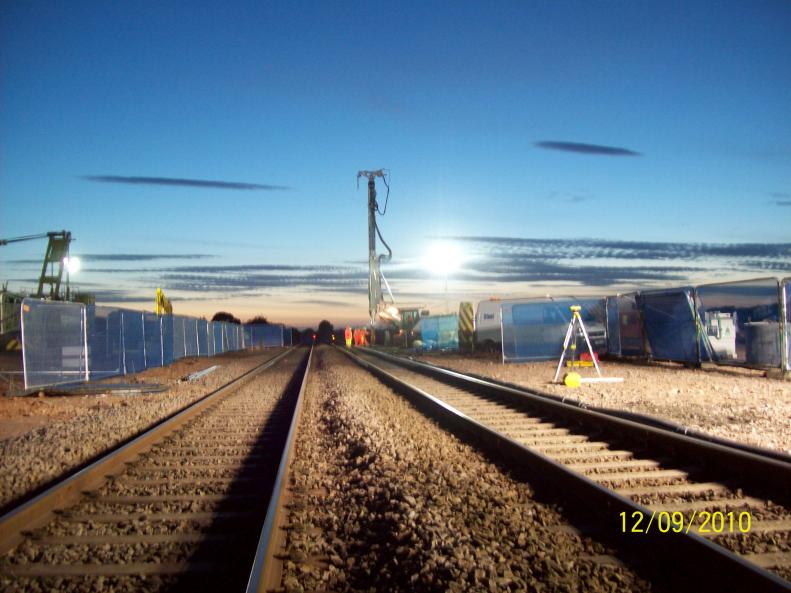 Ivor King driving piles following the movement of the cable cabinet.