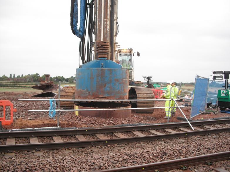 Pile cleaning head attached to the piling rig.