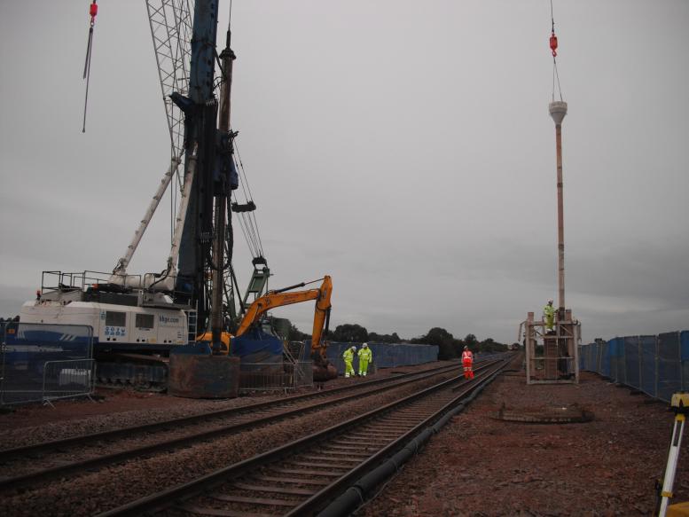 Tremie pipe being connected up lifted into place with the crawler crane