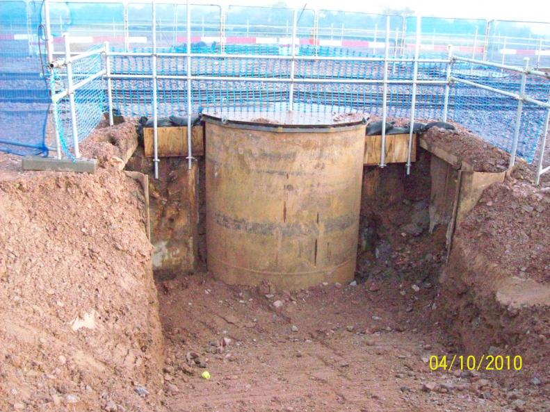 Steel casings  exposed with the front face manhole rings removed.