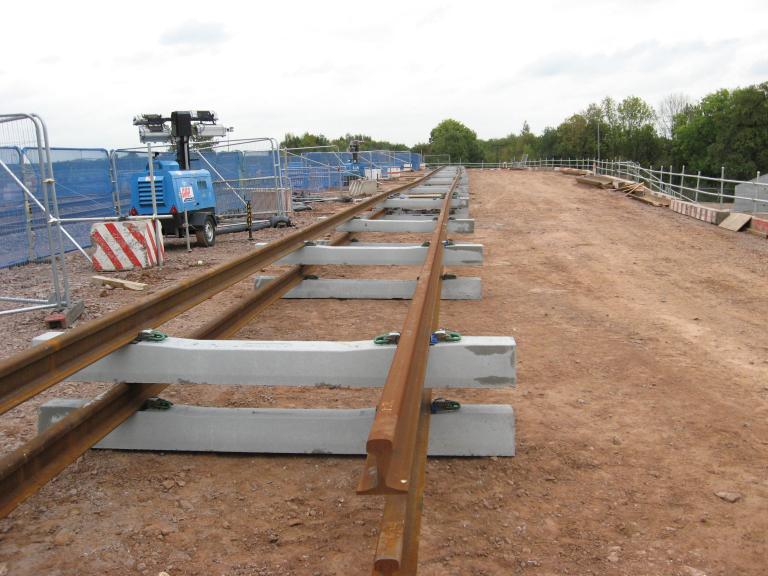 Rails being set up on the South Piling platform with rails being welded to lengths.