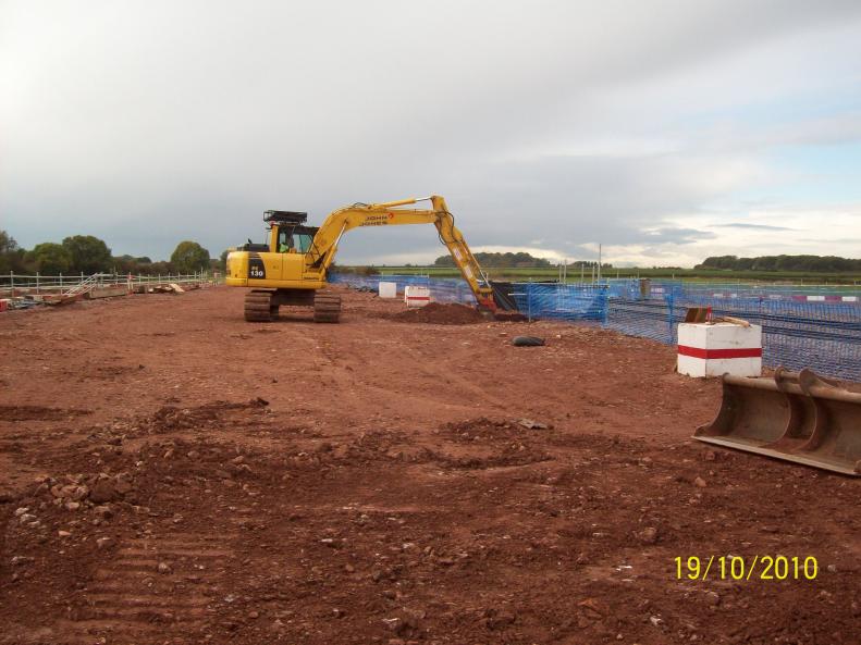 John Jones digging out the southern piling casing on the platform.