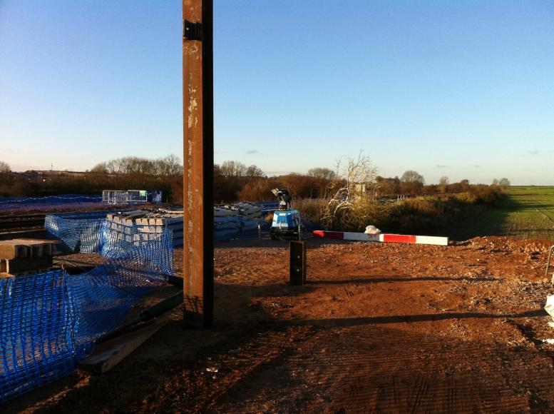 Concrete sleepers are stockpiled ready for Christmas + Cable stay tower for the cable bridge.