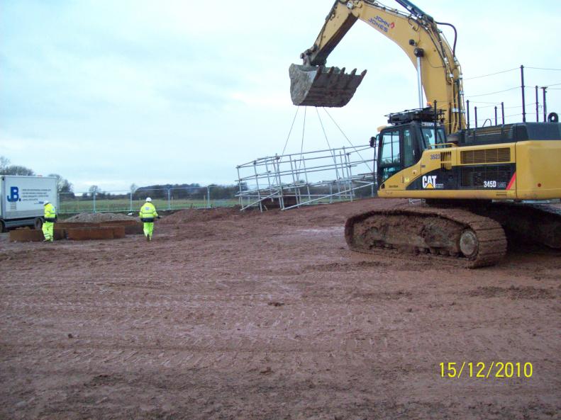 Excavator lifting and moving scaffold access frames.