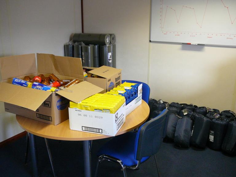 Roll mats, sleeping backs and food - extra supplies just encase the weather stops people leaving site.