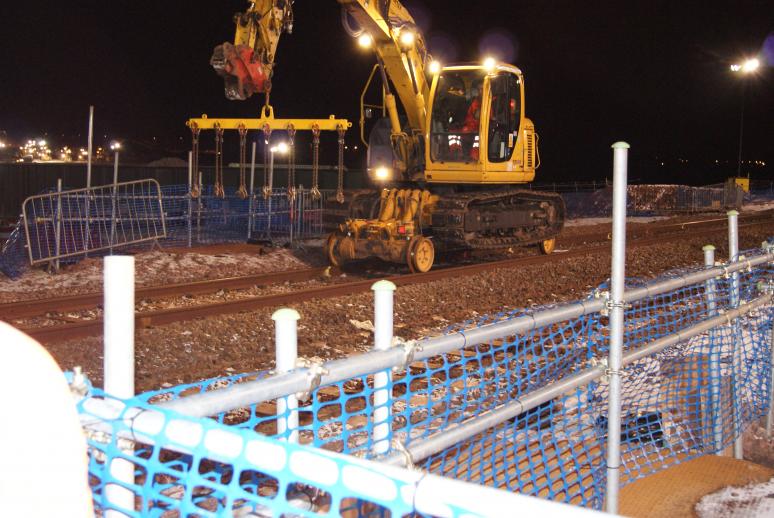 RRV fitted out with sleeper lifting attachment - sleepers for reuse were stockpiled out of the dig area for later reuse.