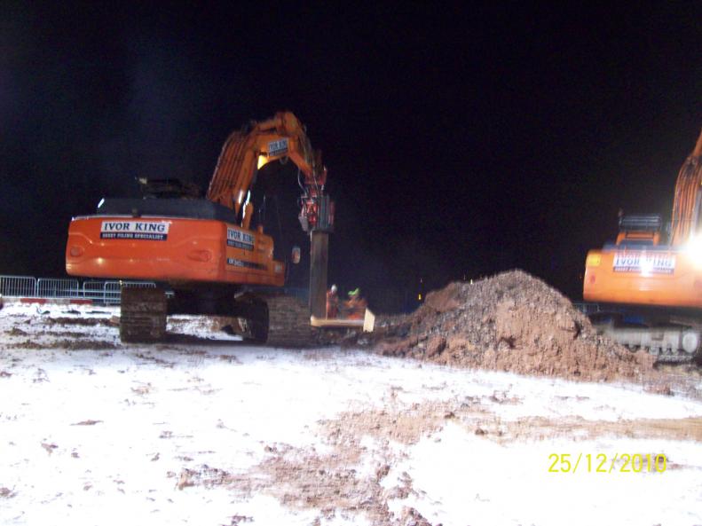 Ivor King Movax rig extracting sheet piles form around the piles.