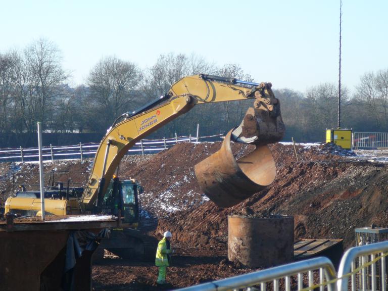 Top section of pile casing being removed.