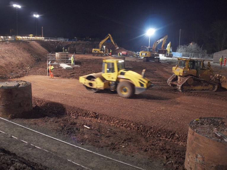 Western drive path being rolled and compacted level.