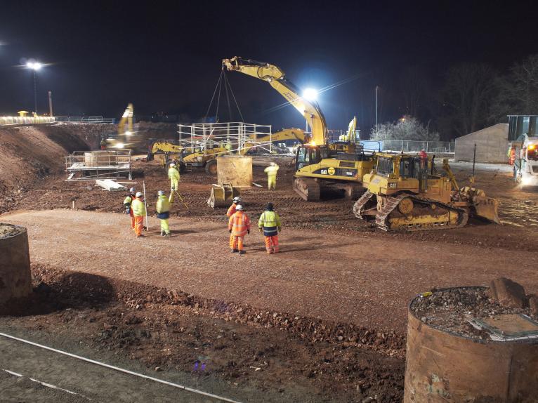 Scaffold frames being lifted in over the central piles.