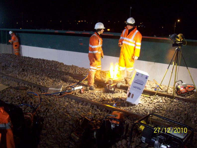 Welding pot being set up on the joint.