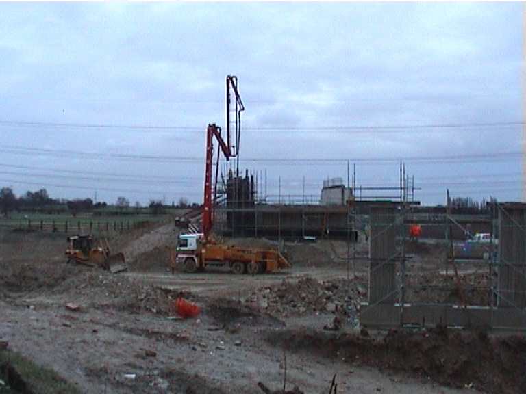 Concrete pump placing concrete to the East Abutment wingwall