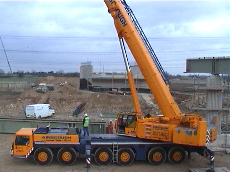 Crane setting up to lift girders