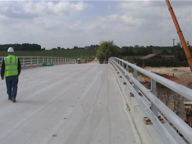 Bridge deck being grit blasted