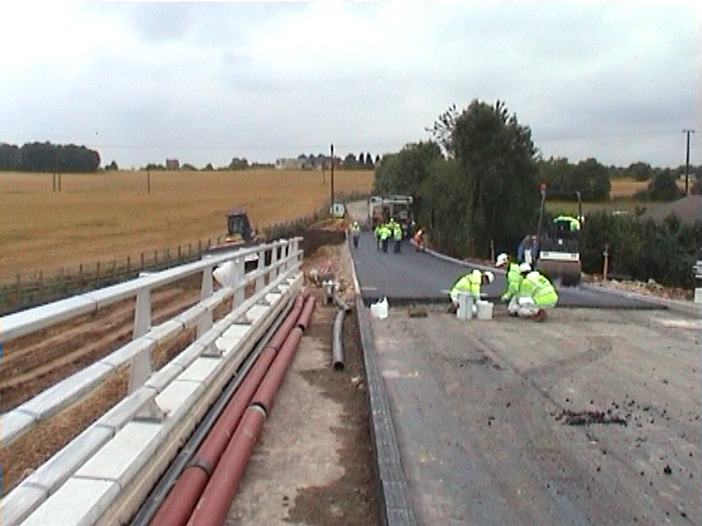 Black top being placed on the approaches