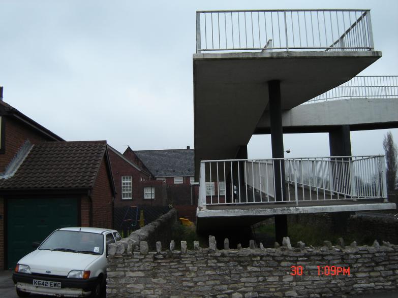 House and school next to the bridge