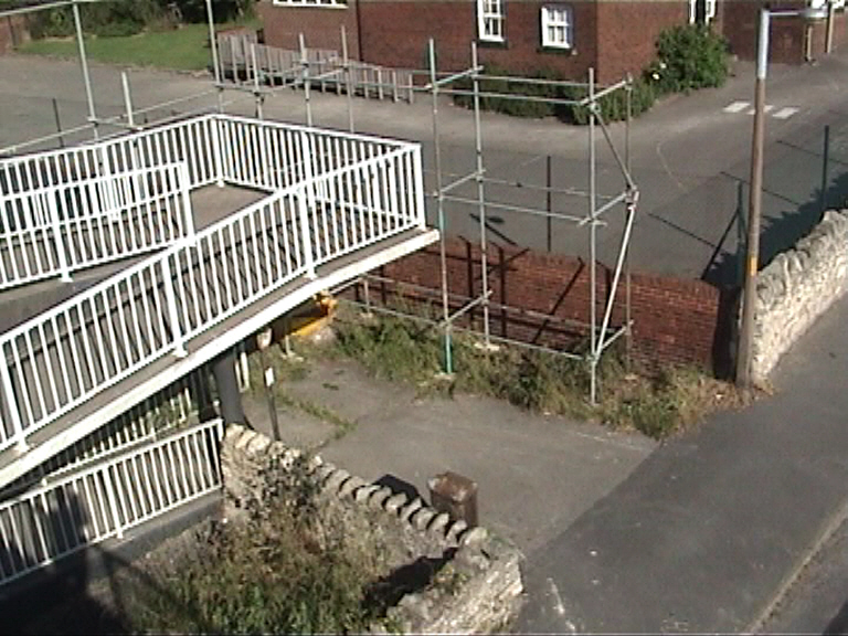 Scaffold screen to protect the school and house