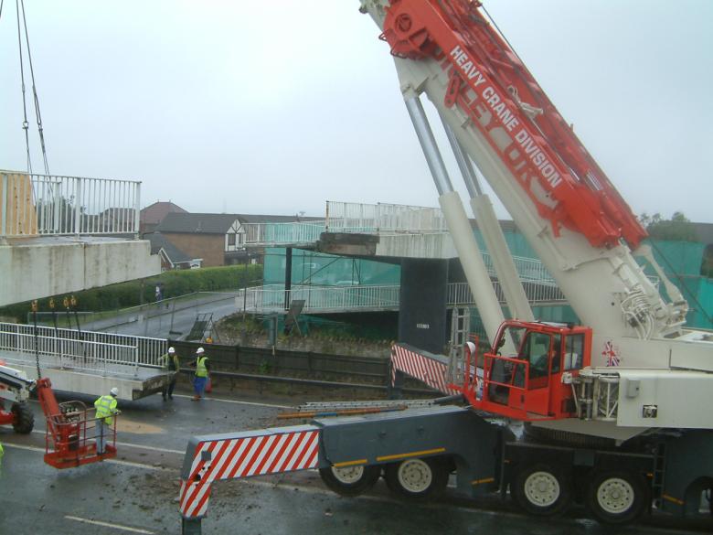 Crane lifting out centre span