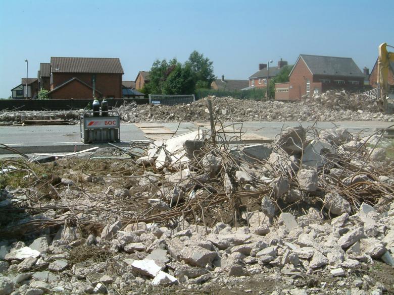 Concrete being broken up and cleared
