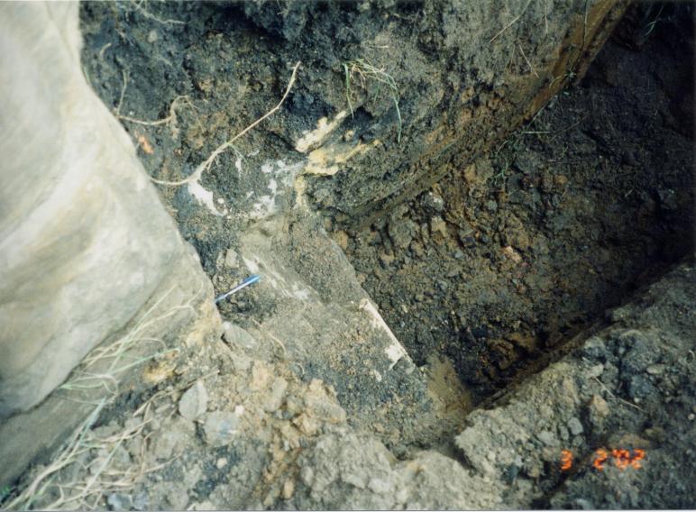 Trial Holes infront of the stucture to check available depth for lowering the road