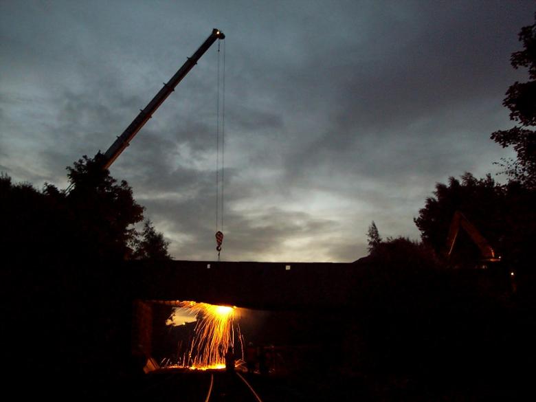 Crane lifting out buckle plates MGL cutting the plates