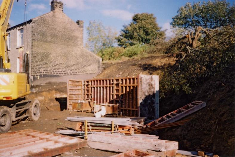 Concrete retaining wall under construction.