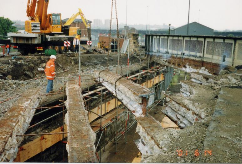 Girders being lifted out by crane