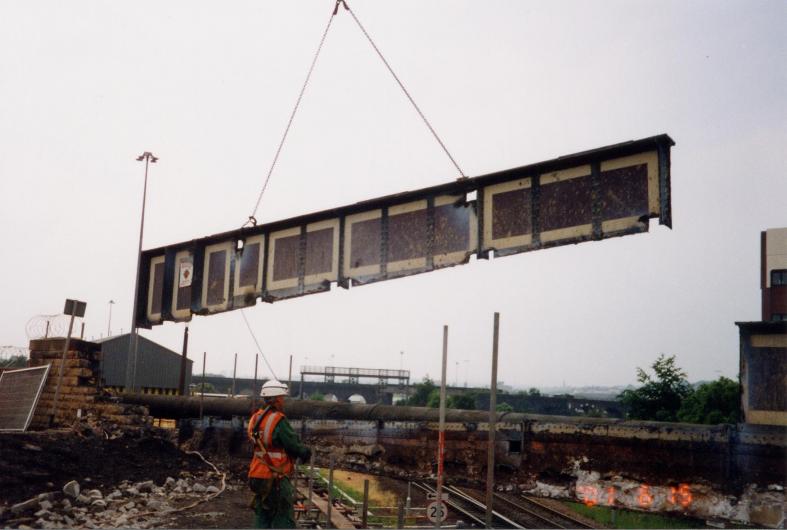 Top section of girder being lifted free