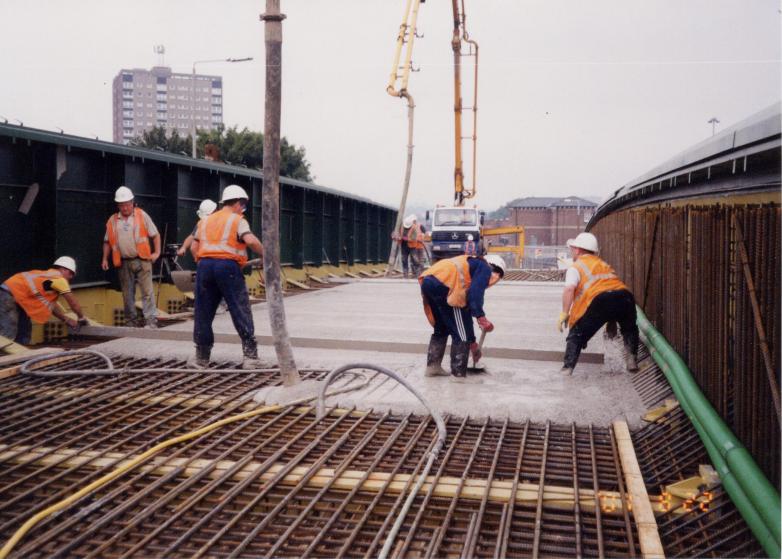 Concrete being placed on the bridge deck.