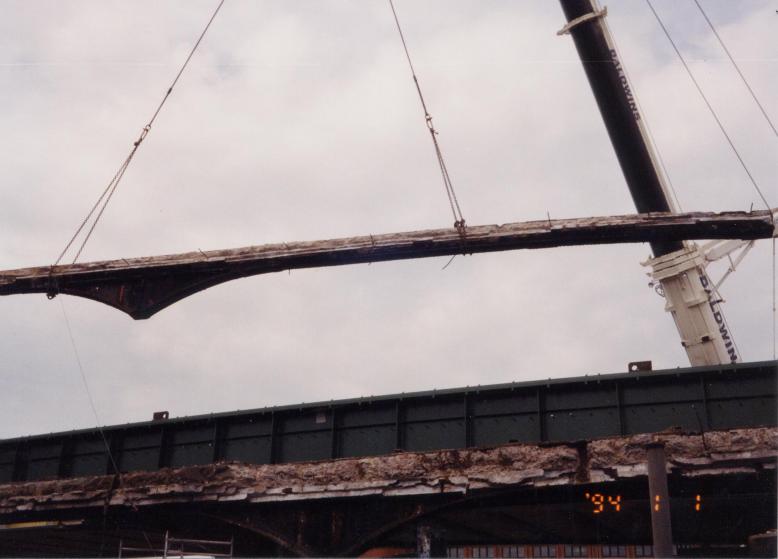 Bridge girders being lifted out.