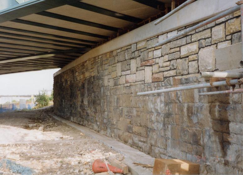 Stone abutment being rebuilt infront of the abutments.