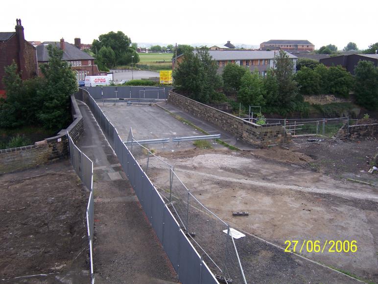 Hillidge Road with fence installed over the bridge to enable the deck to be worked on.