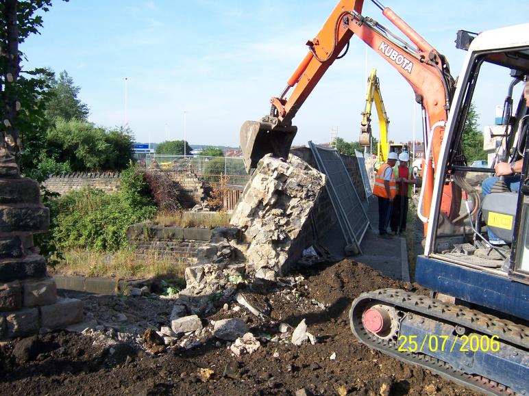 Walls being removed from the North Abutment.