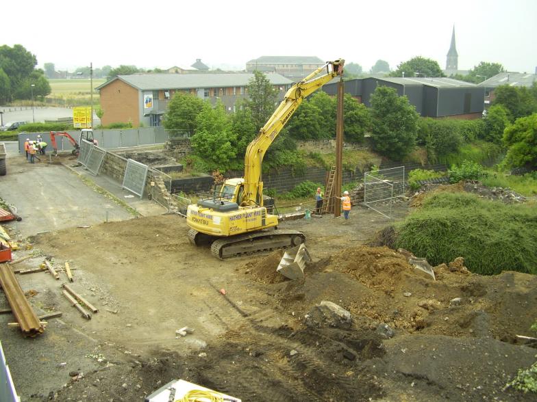 Sheet piles being installed on the south abutment while the wall is broken down on the North side.