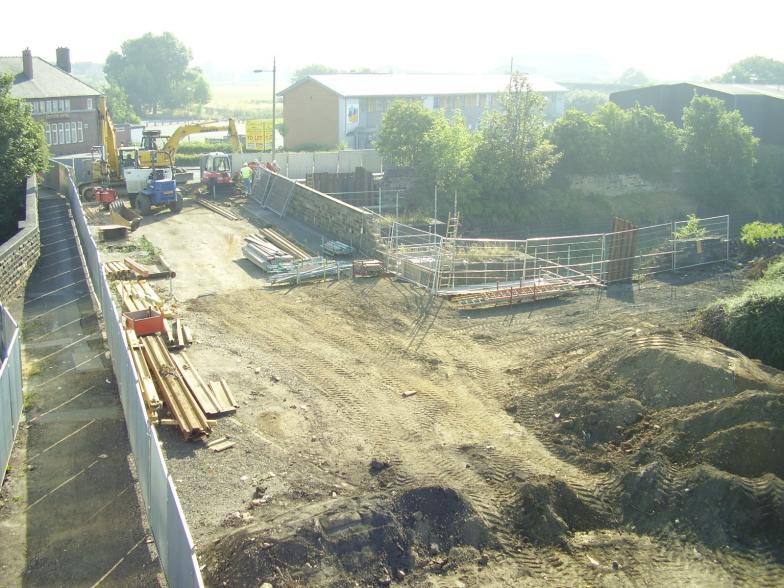 Excavator installing sheet piles on the North Abutment 