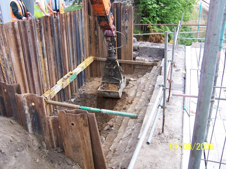 Excavator Grab digging out the North Abutment