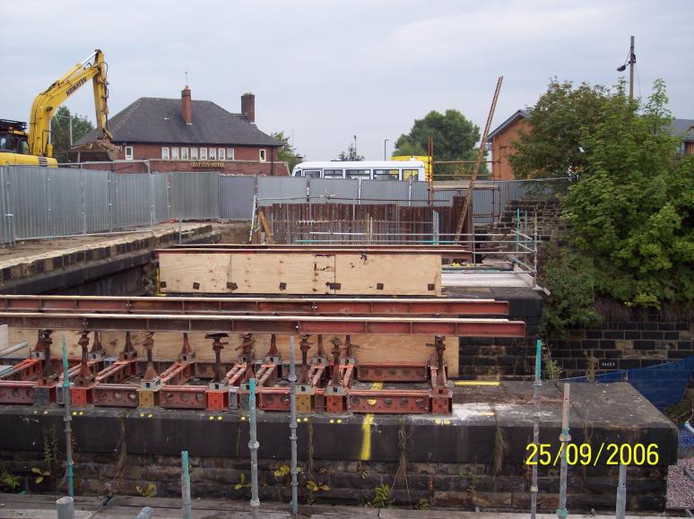 Temporary works installed and parapet wall removed in possession.