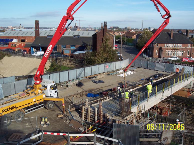 Concrete pump placing concrete to the bridge deck 