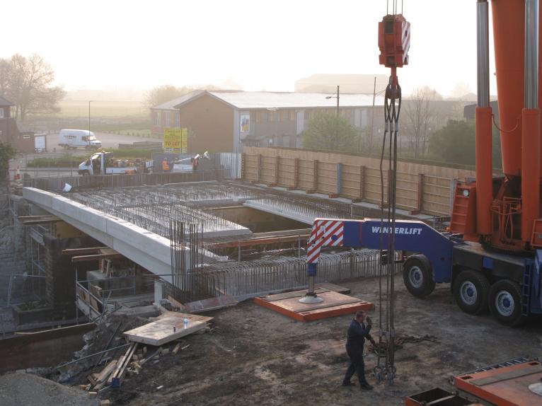 Concrete units being lifted into place.