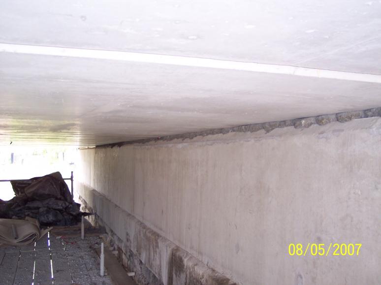 Units set onto grout on the abutments - the shims set the units to level.