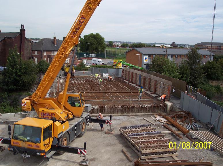 Crane lifting in steel reinforcement onto the bridge deck