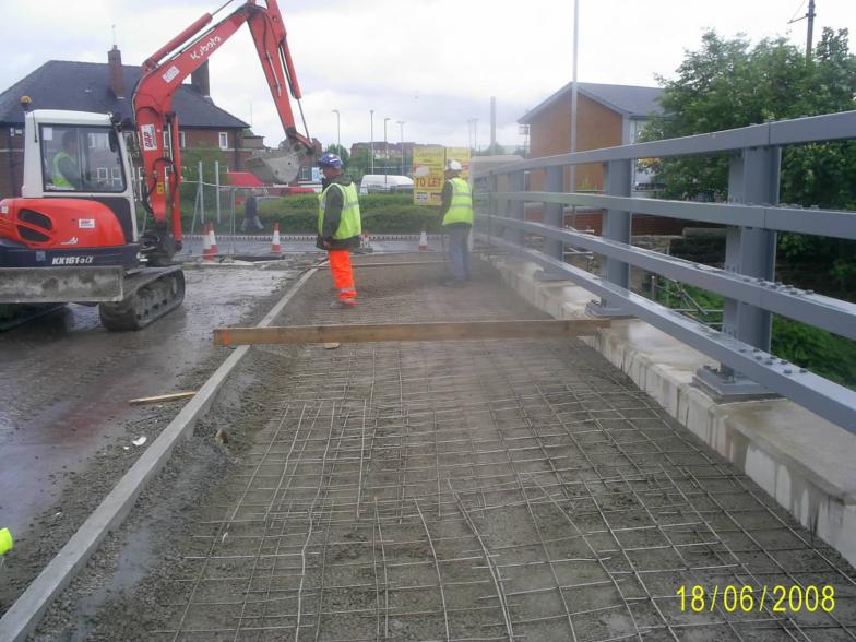 Concrete mesh placed over the ducts on the bridge - being topped up with concrete.