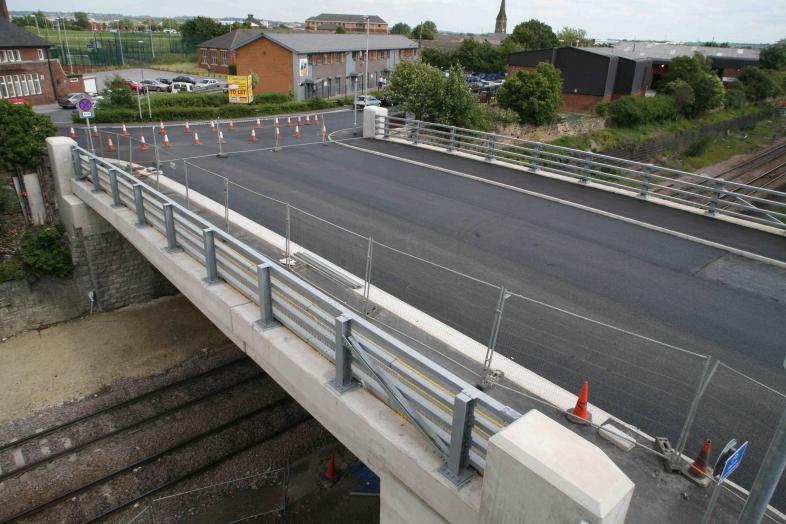 Surface course being laid over the bridge ready for white lines